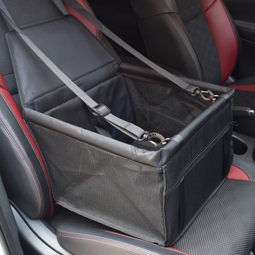 Pet car seat cover with a mesh compartment on a car seat